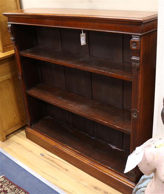 A Victorian walnut open bookcase W.122cm